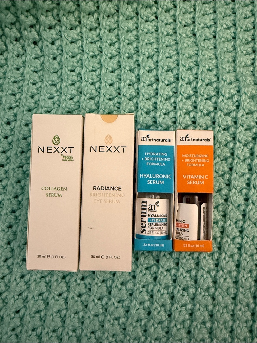 NEXXT & a1 Naturals Skincare Serum Set in White, Teal, and Orange